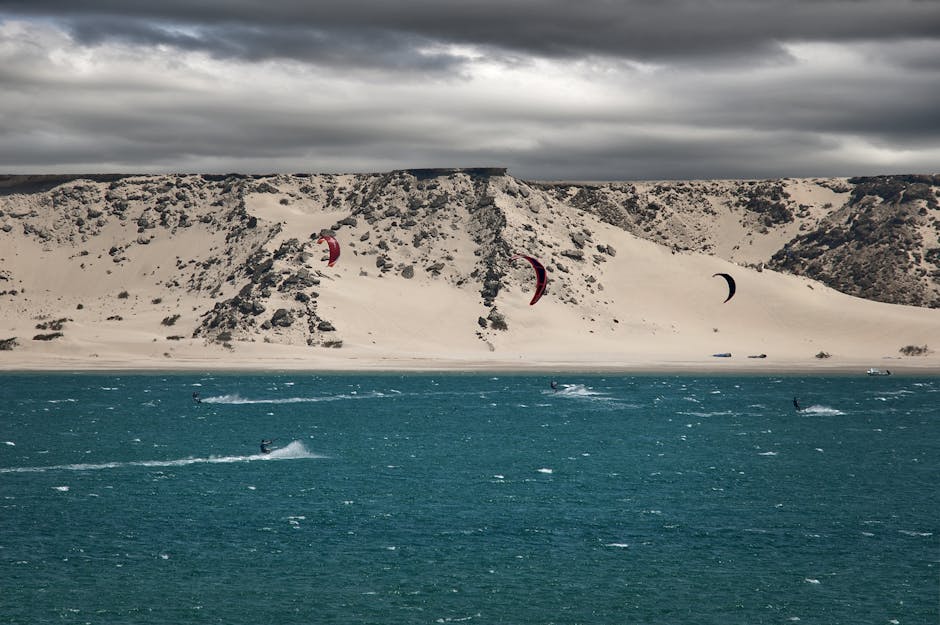 adventure travel beach with dunes and kitesurf
