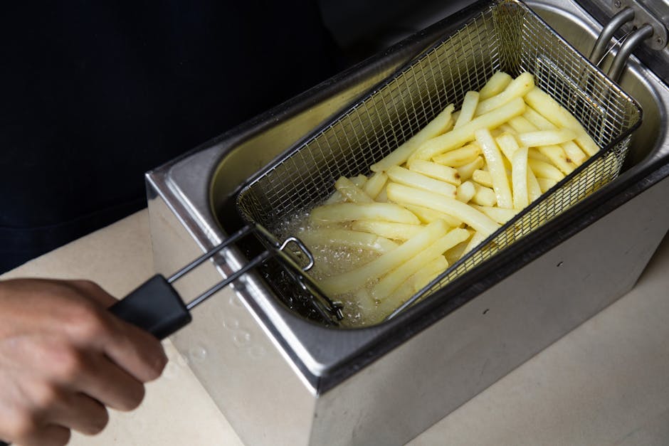 air fryer with Brazilian snacks on kitchen counter