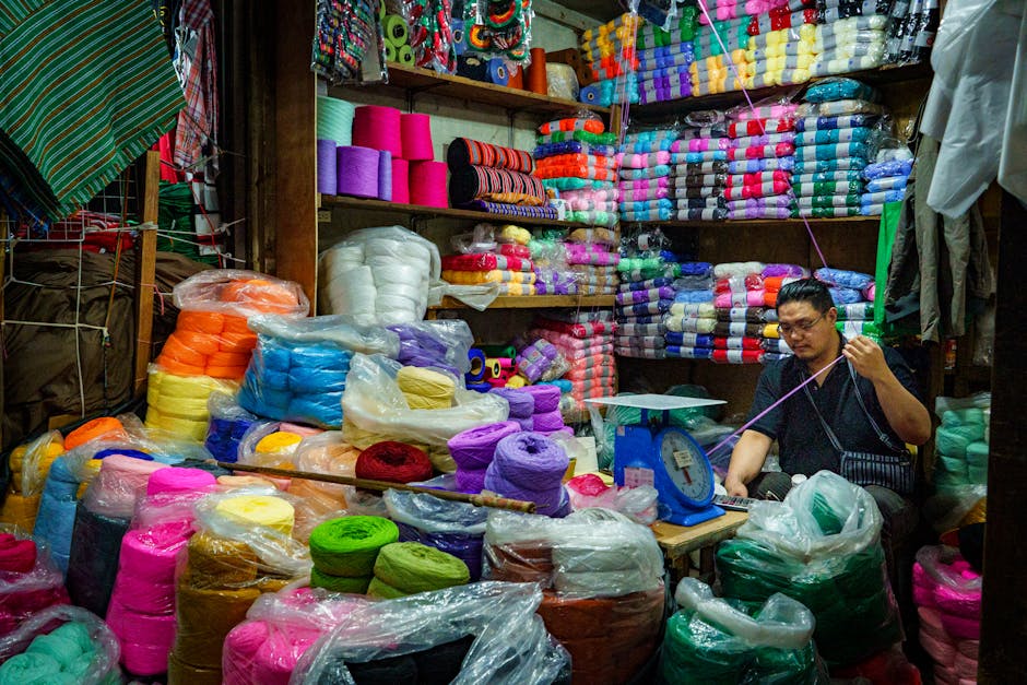 artisan crafting colorful yarn at market stall