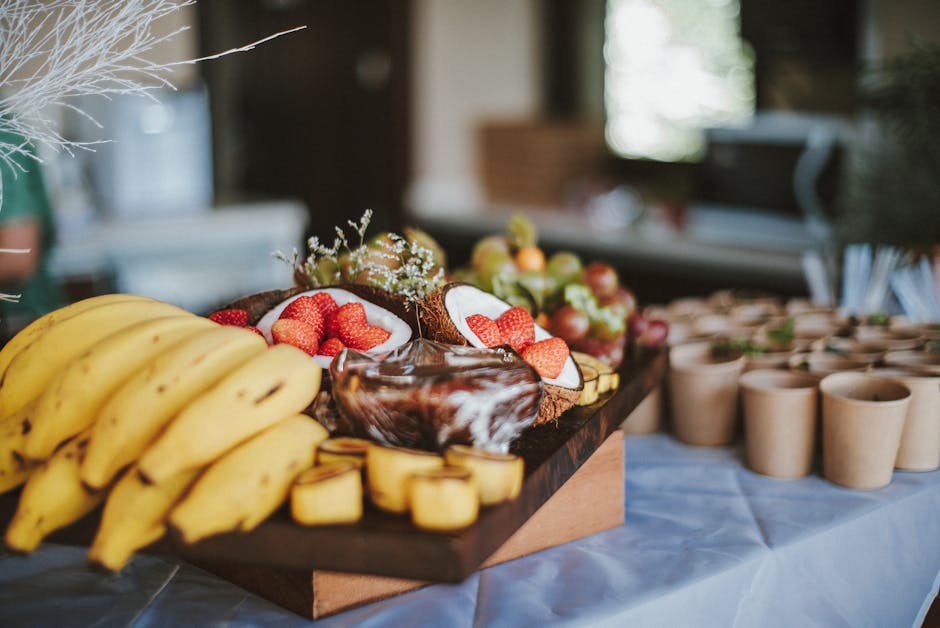 assorted Brazilian native fruits and coconut snacks arranged on a rustic table