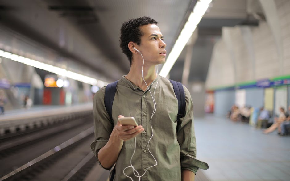 brazilian person listening to podcast on smartphone on commute