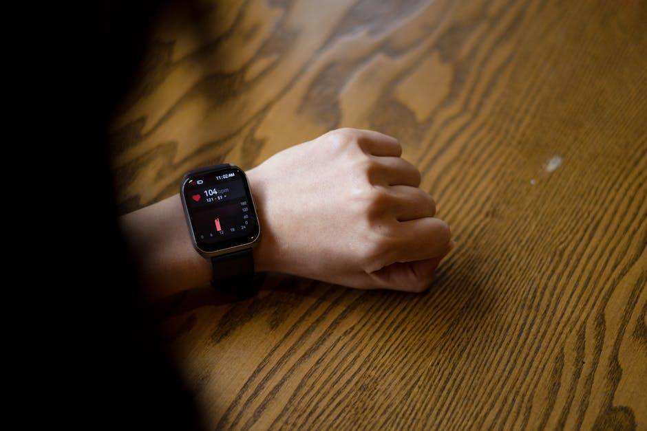 close up smartwatch showing heart rate data on wrist
