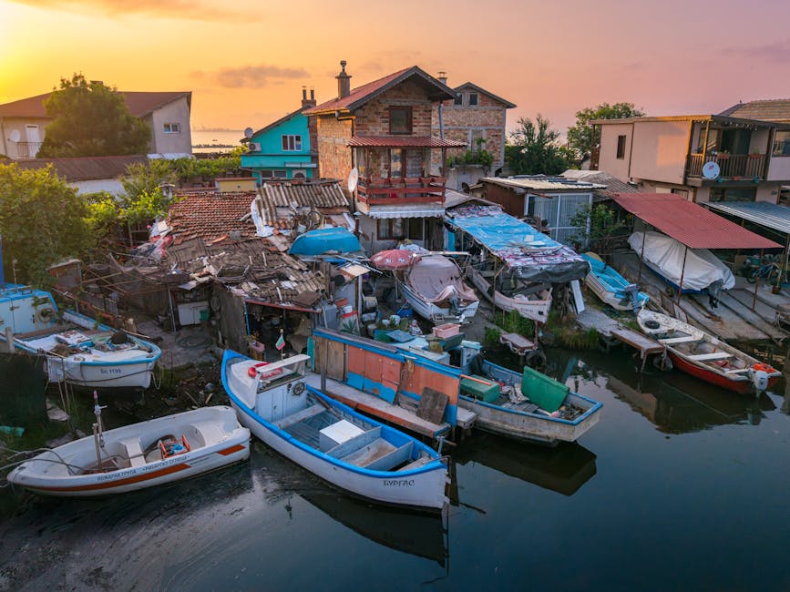 coastal village with colorful boats in morning light