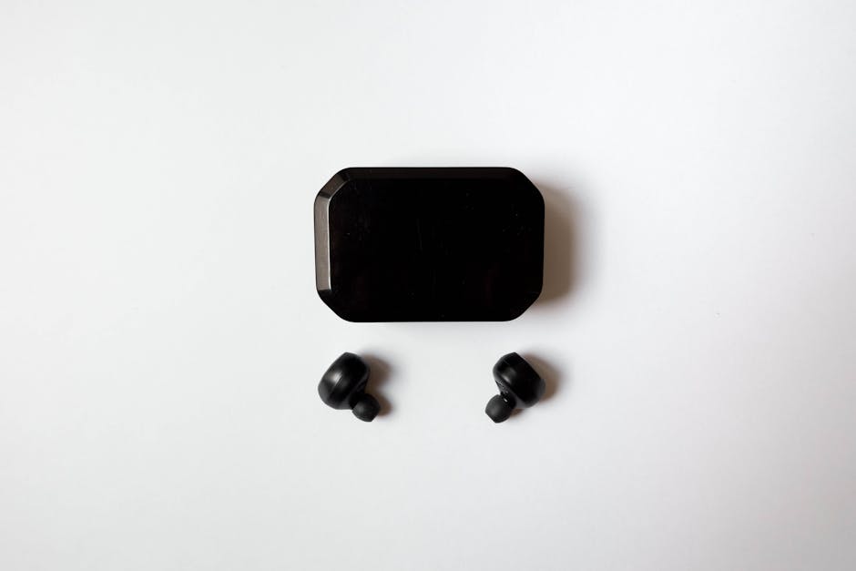 comparison of colorful wireless earbuds on a white table