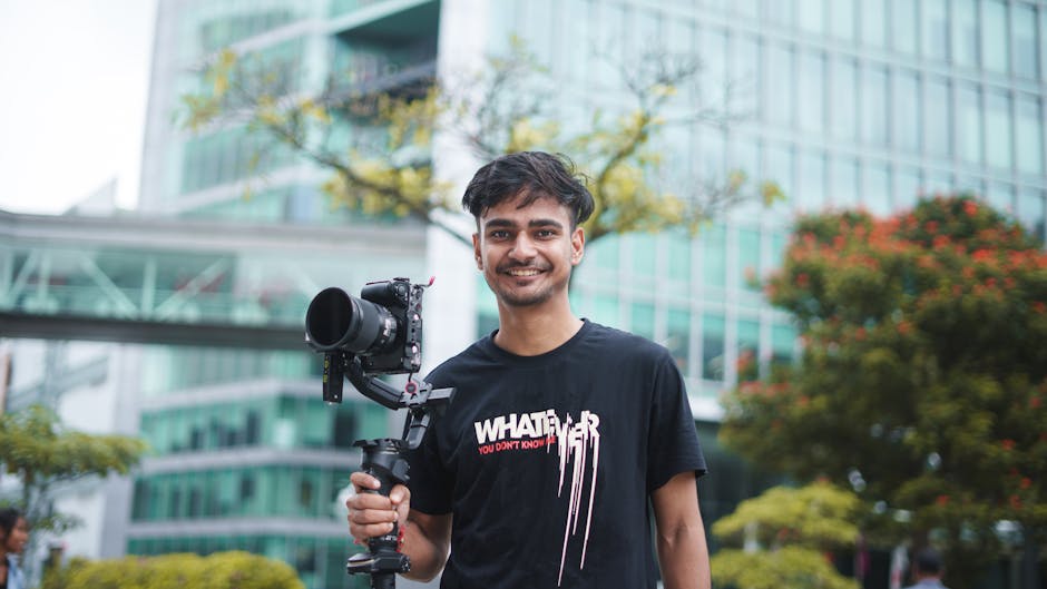 content creator filming with handheld camera outdoors