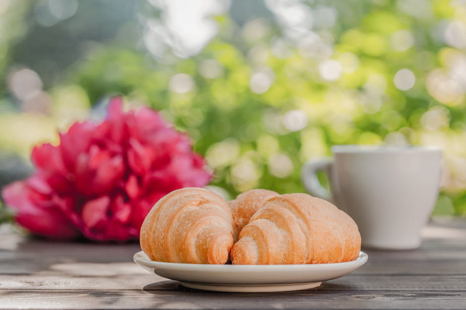 cozy B&B terrace in French countryside with coffee and croissants