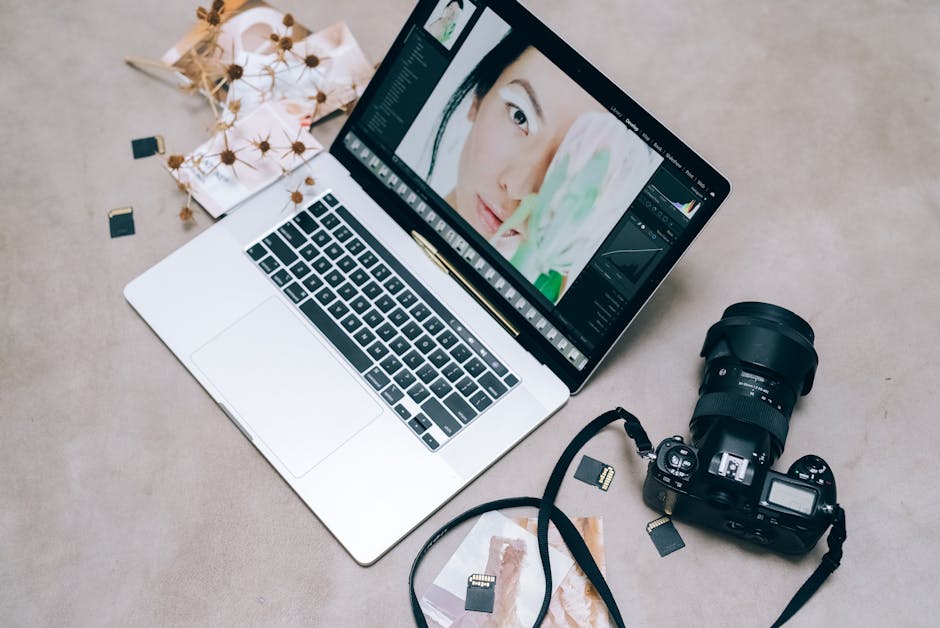 creative workspace with laptop and camera