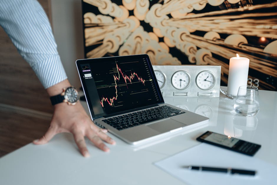crypto investor analyzing charts on laptop