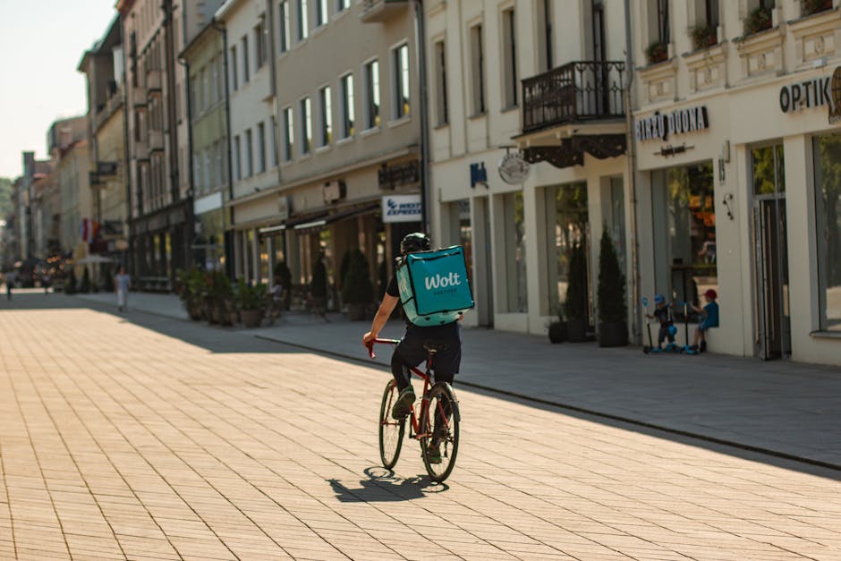 delivery cyclist on polish city street
