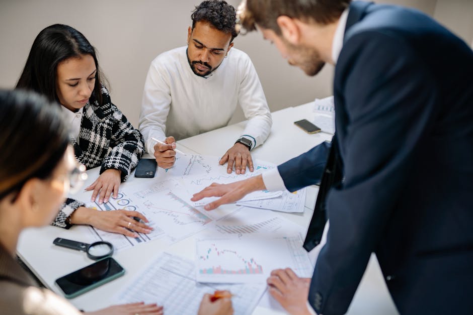 diverse group discussing financial charts together