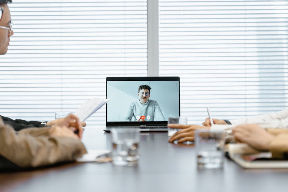 diverse team video meeting laptop