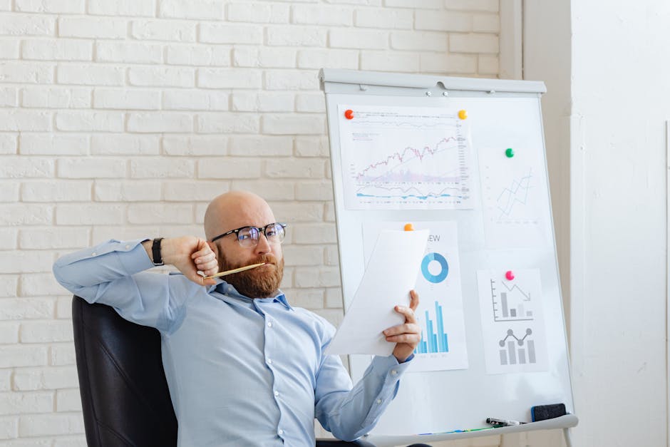 entrepreneur reviewing financial charts at desk
