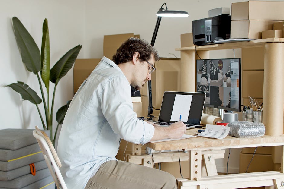 entrepreneur working on laptop at home office