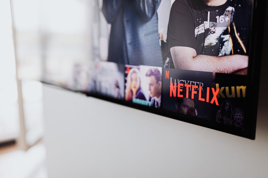 family watching streaming service on big screen tv