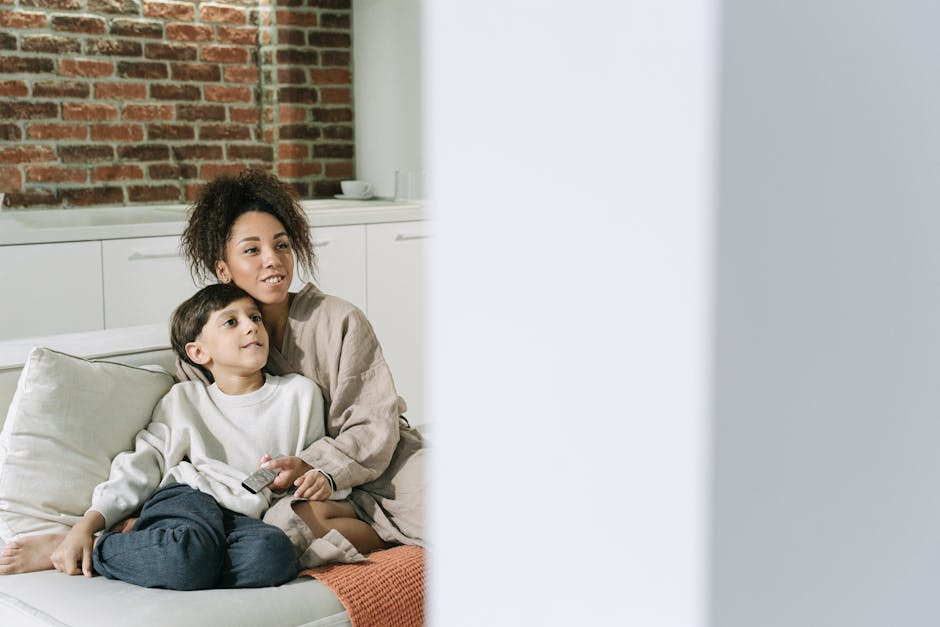 family watching television together in cozy home