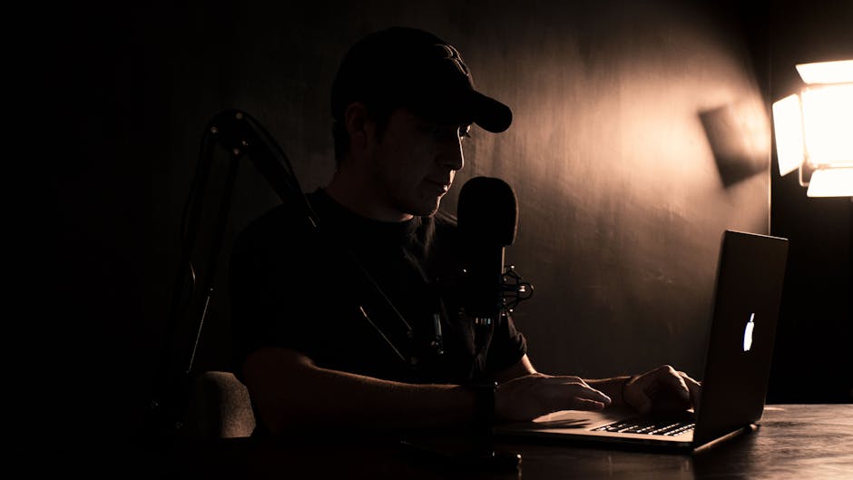 french creator posing with laptop at workspace