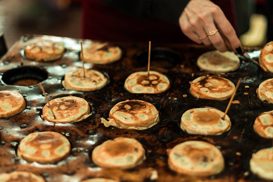 fresh tapioca being pressed on a hot griddle with coconut
