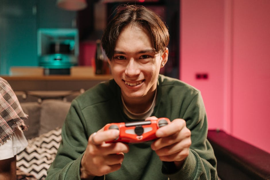 gamer holding video game controller smiling
