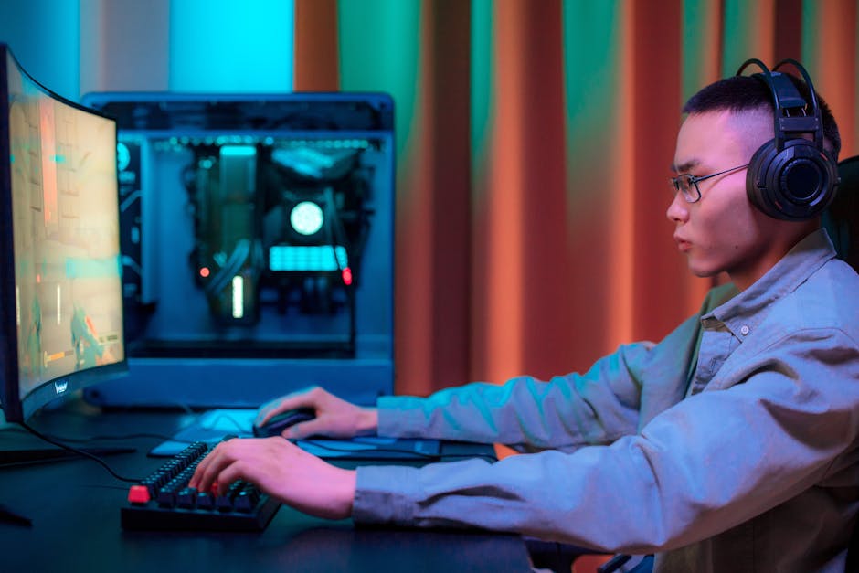 gamer wearing headphones at desk with RGB lighting