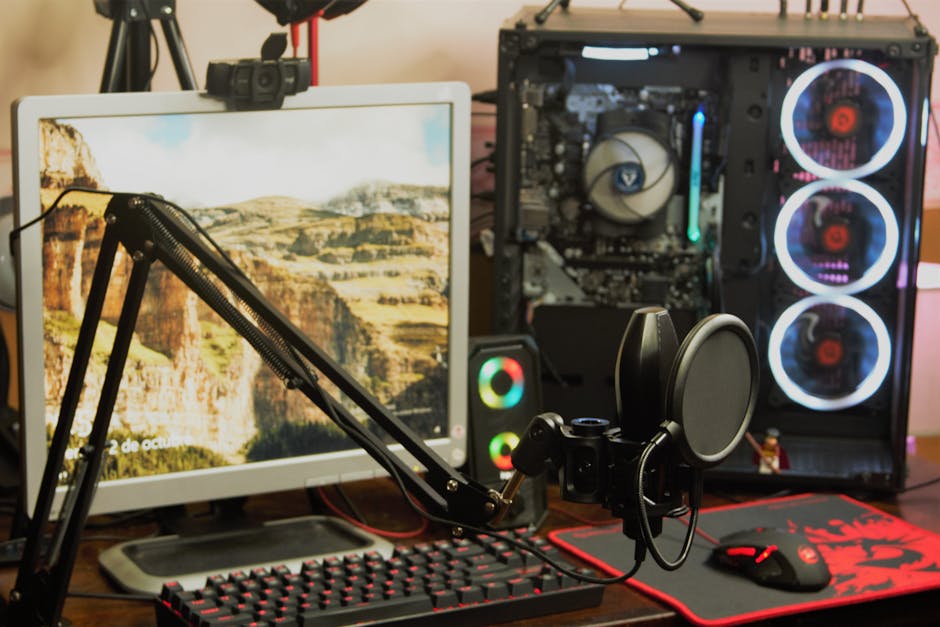 Gaming setup with multiple monitors and microphone
