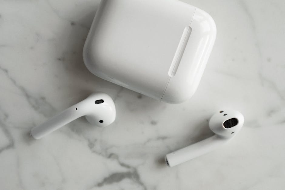 group of colorful earbuds with charging case