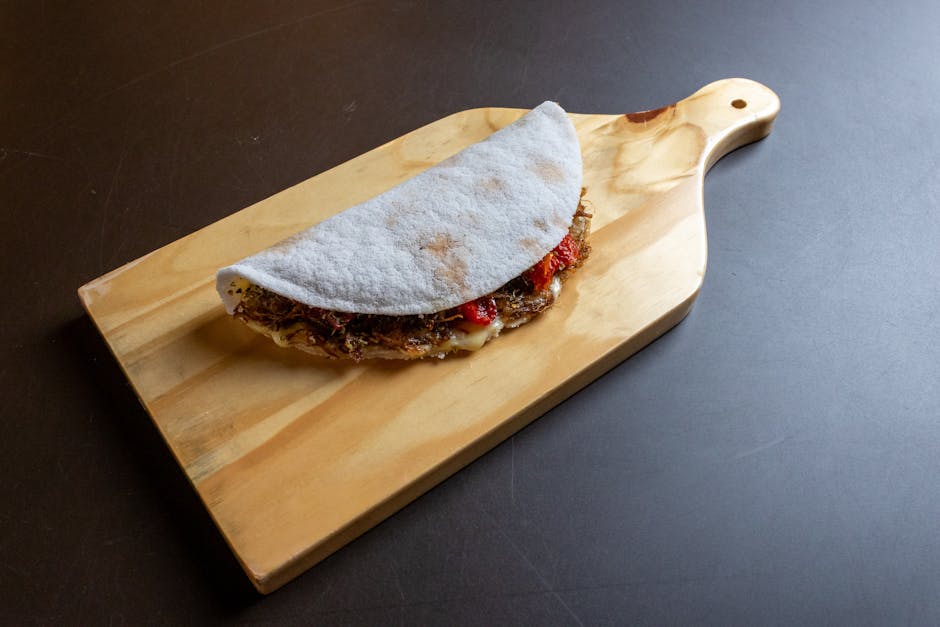hands holding tapioca snack with toppings