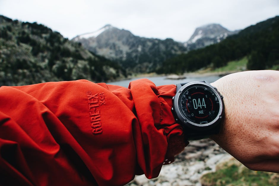 hiker wearing GPS smartwatch on mountain trail