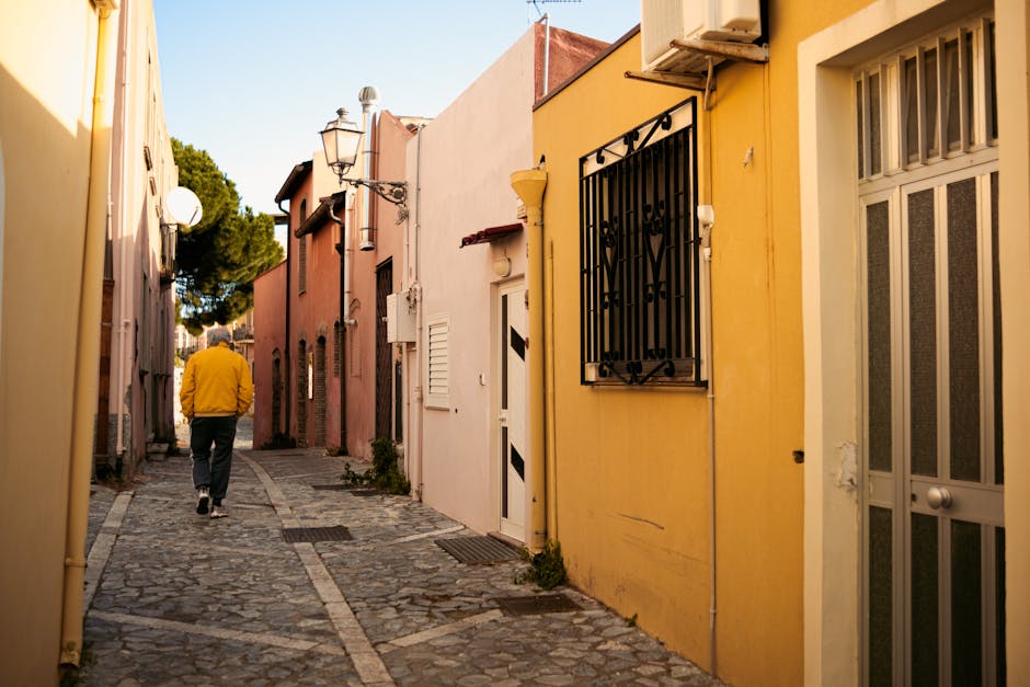 man walking alone on cobblestone street in Brazilian town