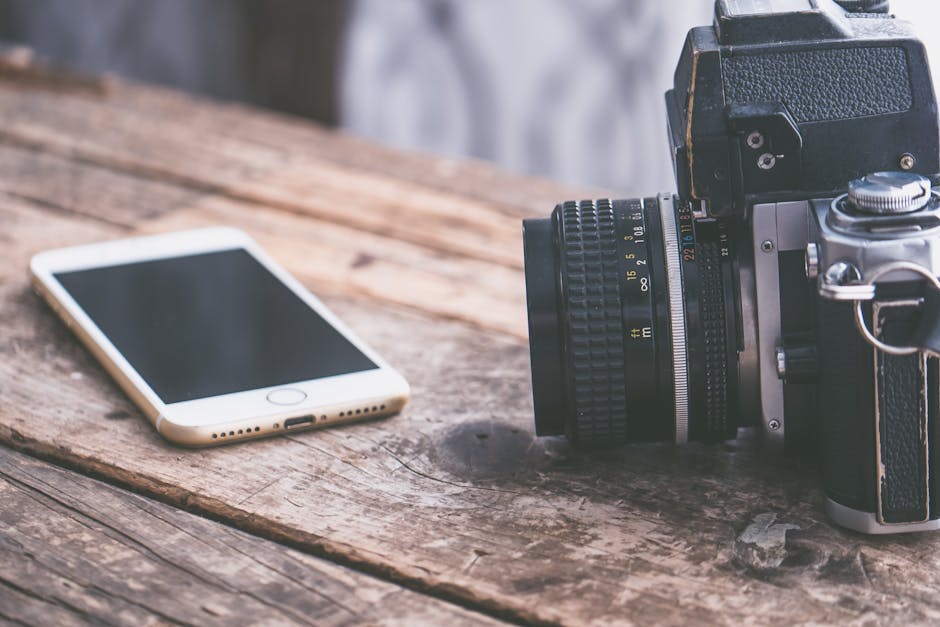 modern smartphone with camera on table