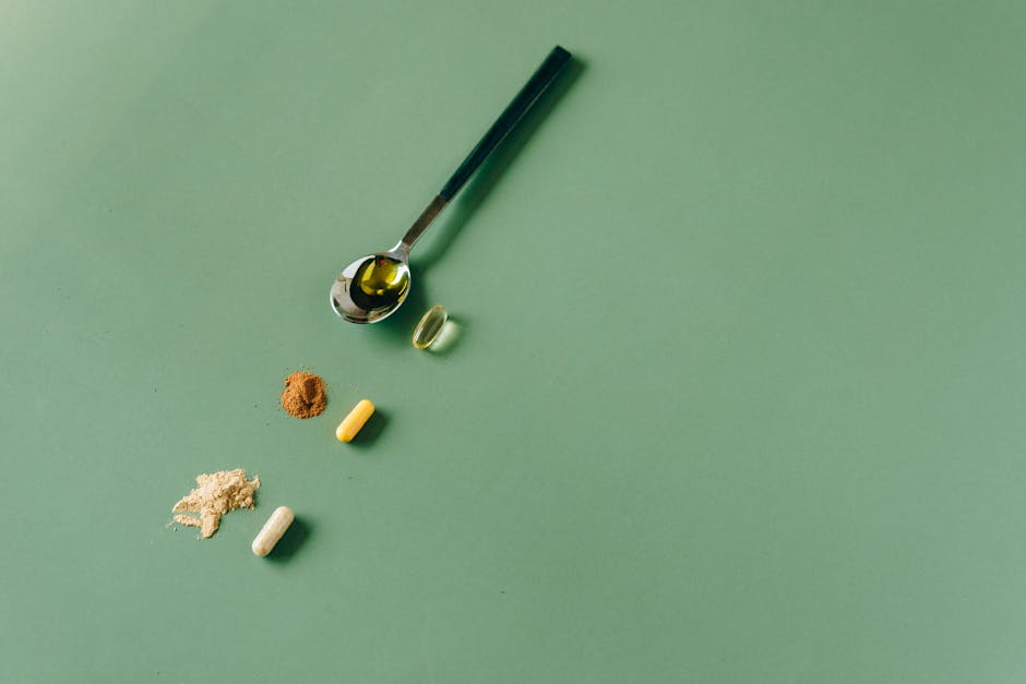 Natural food supplement capsules and organic superfoods flat lay