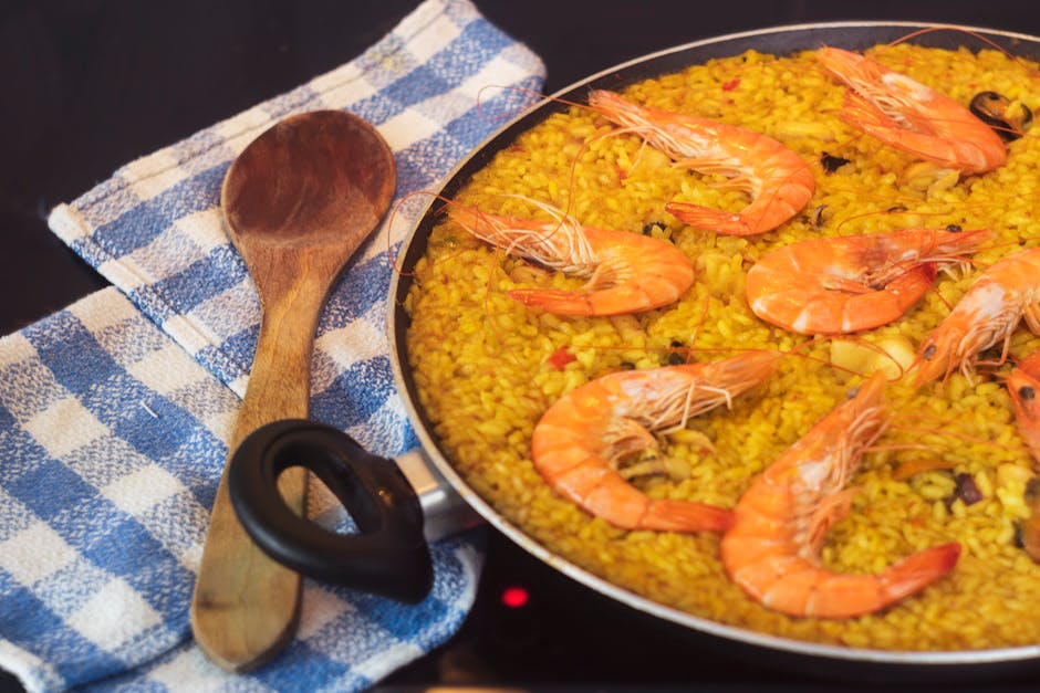 paella pan with saffron rice and seafood
