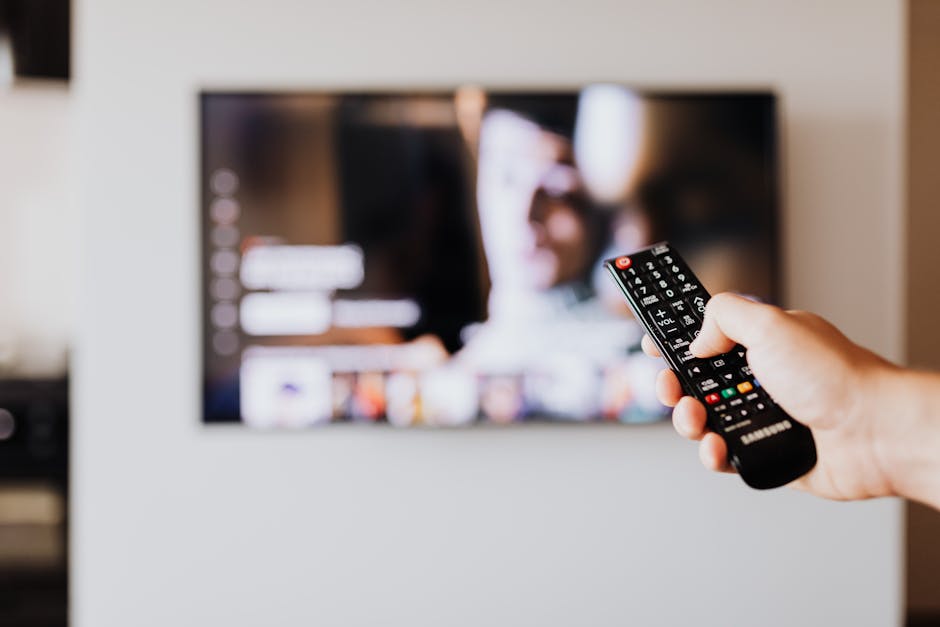 person browsing smart TV settings remote control