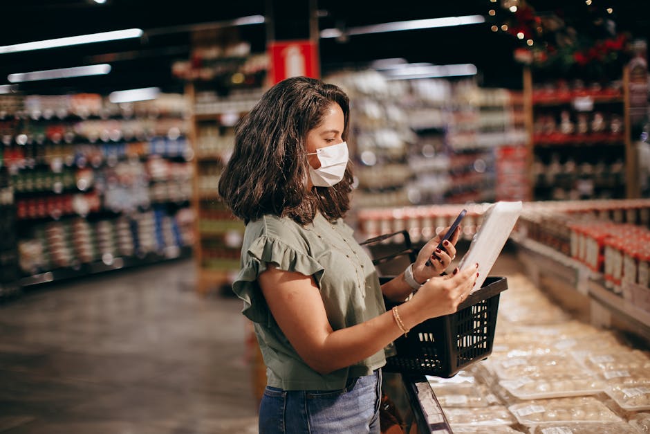 person checking out on mobile phone with cart