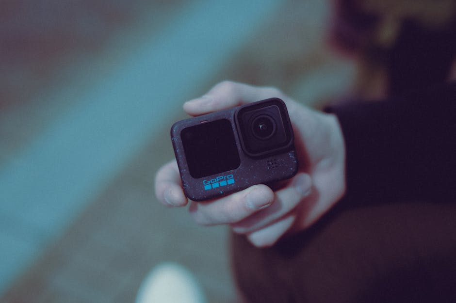 person holding lightweight action camera filming outdoor adventure Spain