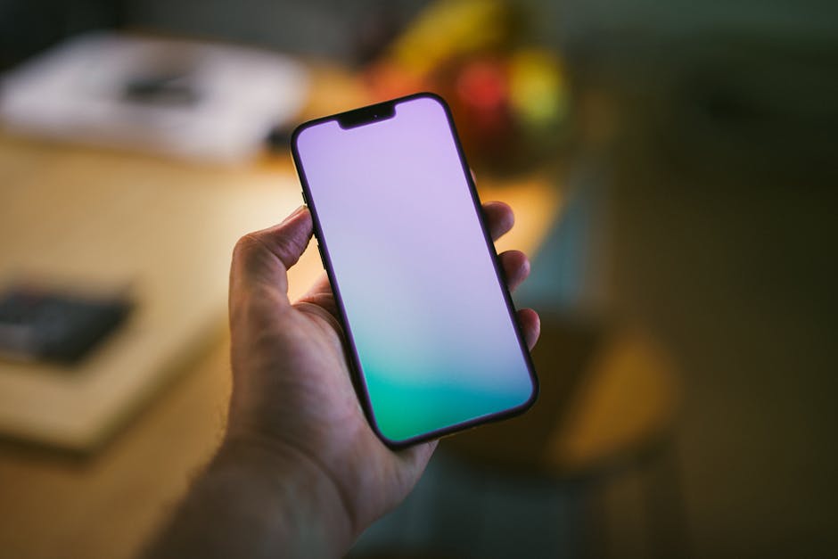 person holding smartphone with smart home app