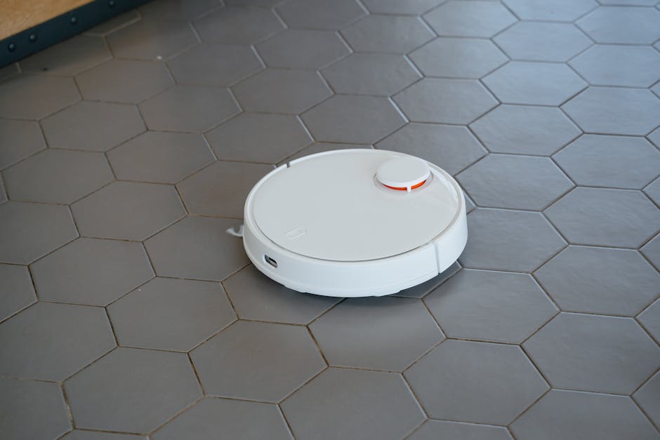 robot vacuum cleaning modern tiled floor in apartment