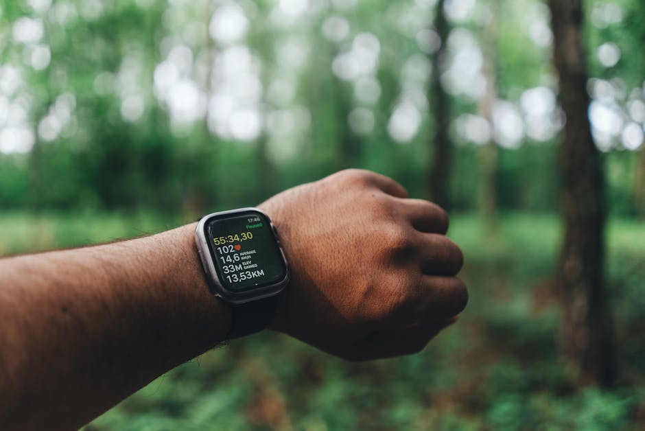runner checking smartwatch heart rate data outdoors
