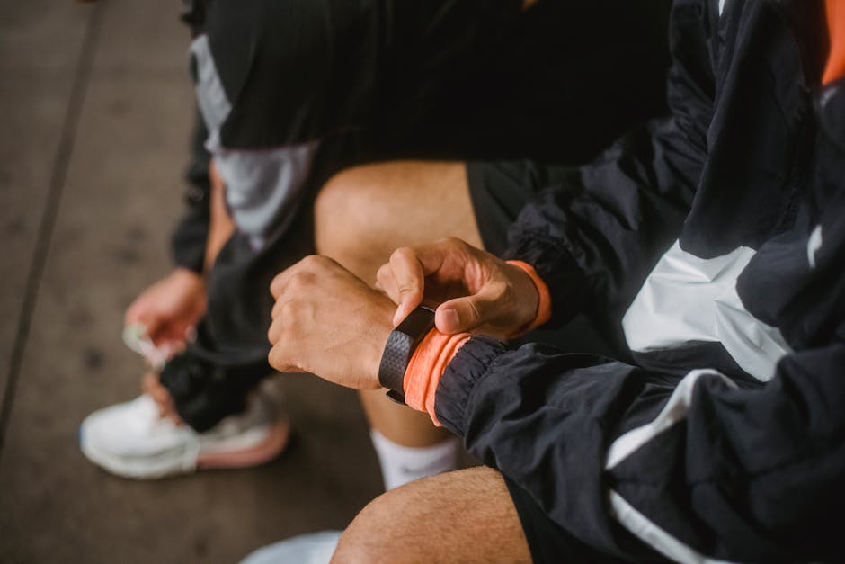runner wearing GPS sports watch outdoors