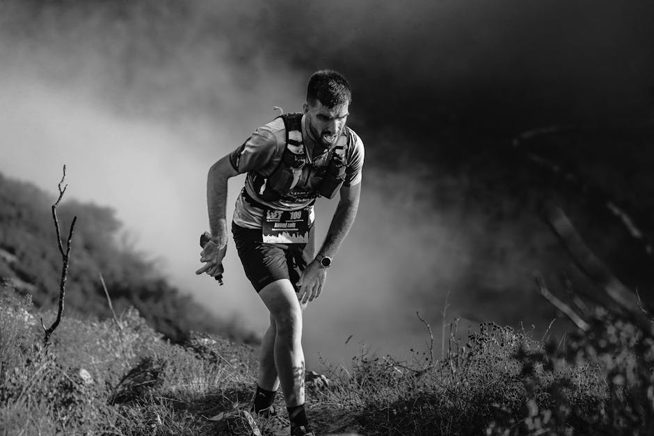 Runner with fitness watch on French trail