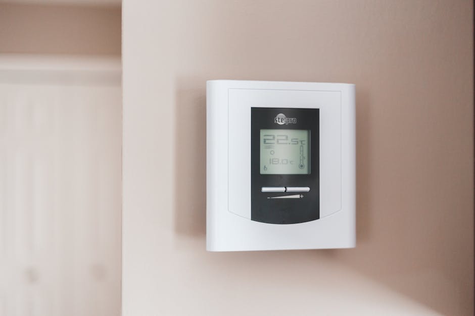 smart thermostat installation on wall in modern home
