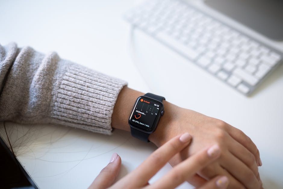 smartwatch displaying fitness stats on wrist