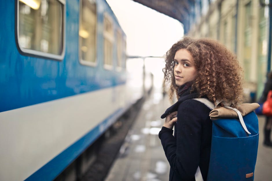 solo female traveler at train station platform in France