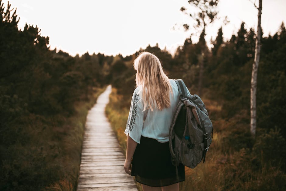 solo woman hiking on Black Forest trail at sunset