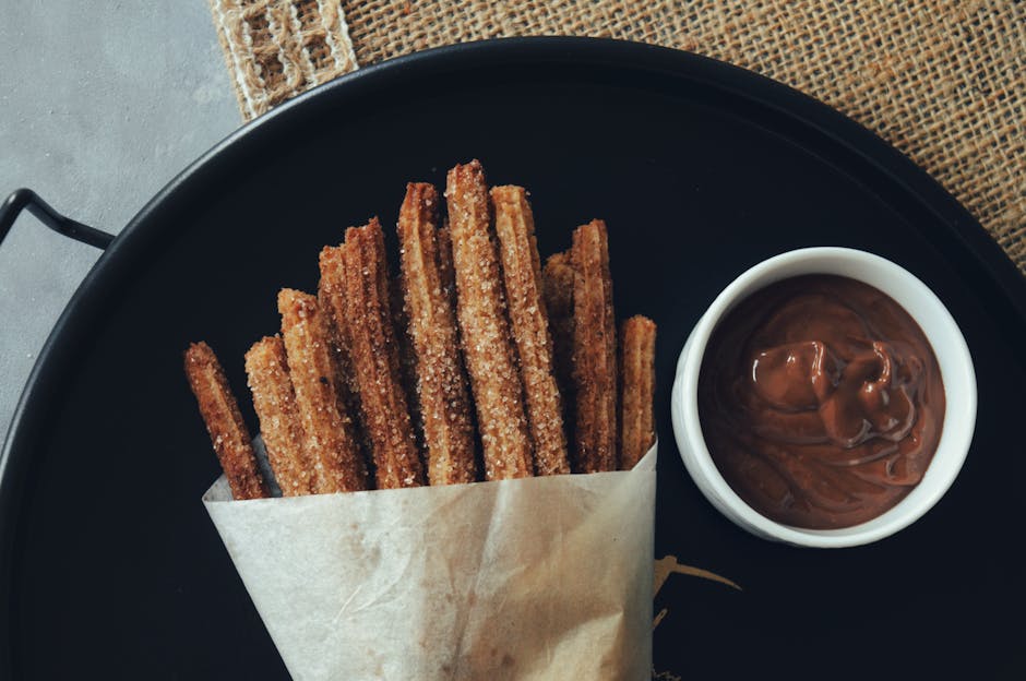 traditional Spanish churros with thick hot chocolate in Madrid cafe