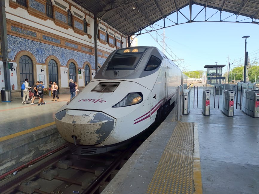 Train arriving at historical Spanish station