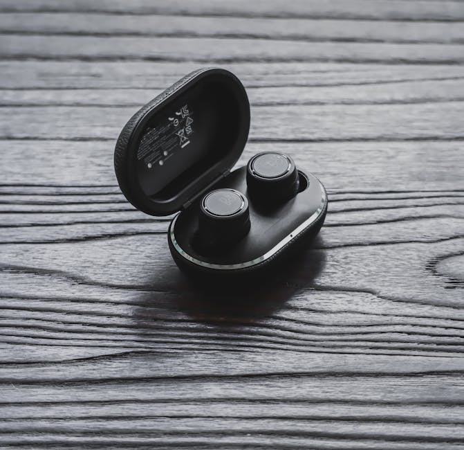 wireless earbuds on charging case closeup