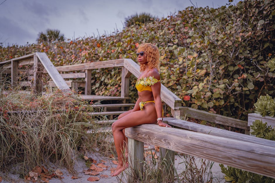 Woman wearing vibrant cutout swimwear on beach