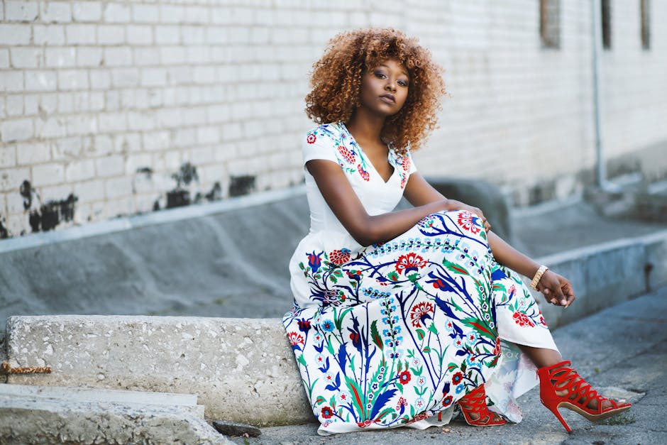 Woman wearing vibrant floral dress on street