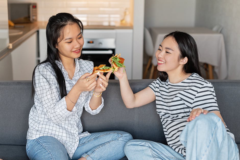 women sharing meals in Polish hostel common room