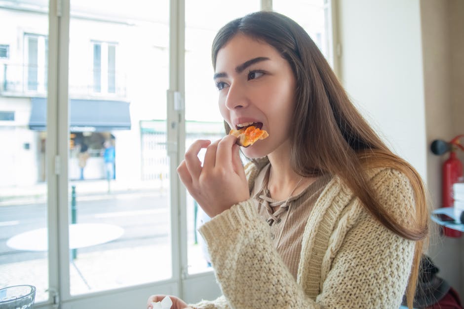 young woman eating healthy snack in Madrid cafe